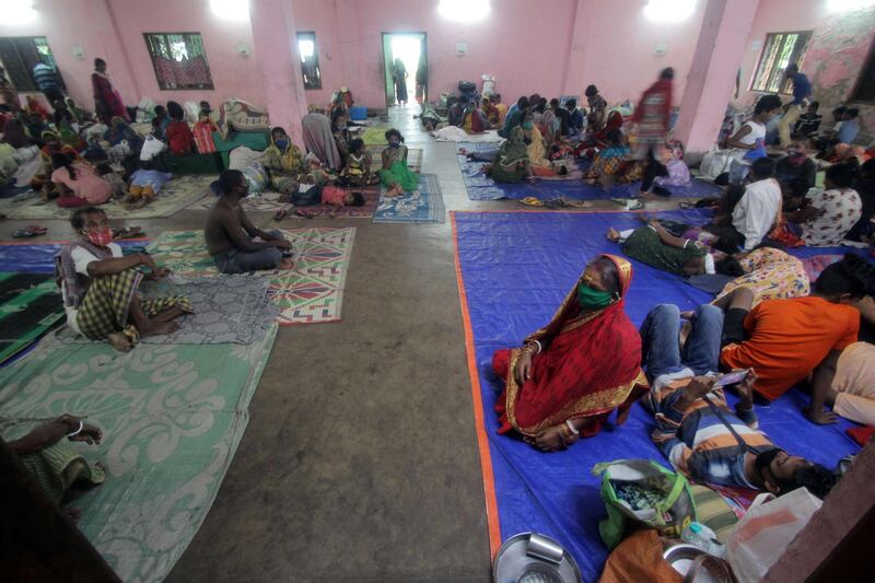People rest in a temporary cyclone relief shelter at Paradeep, Odisha, India as cyclone Amphan approaches. EPA