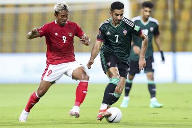 Ali Mabkhout of the UAE battles with Kushedya Hari Yudo of Indonesia during the game between the UAE and Indonesia in the World cup qualifiers at the Zabeel Stadium, Dubai on June 11th, 2021. Chris Whiteoak / The National. Reporter: John McAuley for Sport