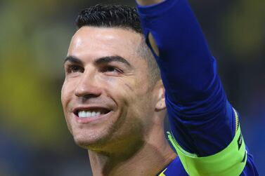 Nassr's Portuguese forward Cristiano Ronaldo greets supporters ahead of the Saudi Pro League football match between Al-Nassr and Al-Ettifaq at the King Fahd Stadium in the Saudi capital Riyadh on January 22, 2023.  (Photo by Fayez NURELDINE  /  AFP)