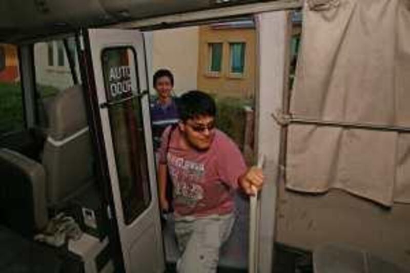 Dubai, 30th October 2008.  (Right to left) Hajiaga Mosaycu and Daniyar Rakhimov, boards the bus that would take them to Ajman.  (Jeffrey E. Biteng / The National) *** Local Caption ***  JB06-Students.jpgJB06-Students.jpg