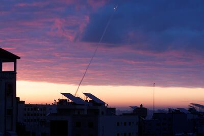 Trails of smoke are seen as rockets are fired from Gaza towards Israel during the sunrise, in Gaza City February 23, 2023. Reuters