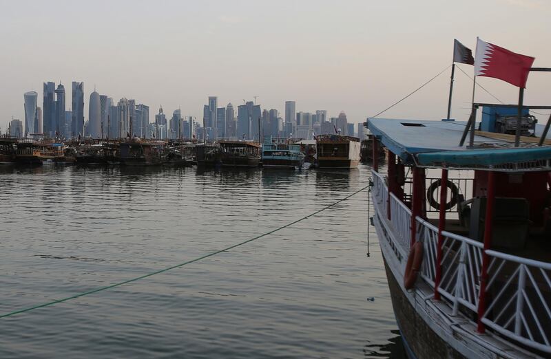 In this May 3, 2018 photo, commercial dhows anchor at the bay of Doha, Qatar. A year into a blockade by four Arab states against Qatar, the small country has weathered the storm by drawing from its substantial financial coffers, using its strategic location in the Persian Gulf as the worldâ€™s largest producer of liquefied natural gas to continue shipments to major world powers, and forging tight alliances with countries like Turkey and Iran. (AP Photo/Kamran Jebreili)