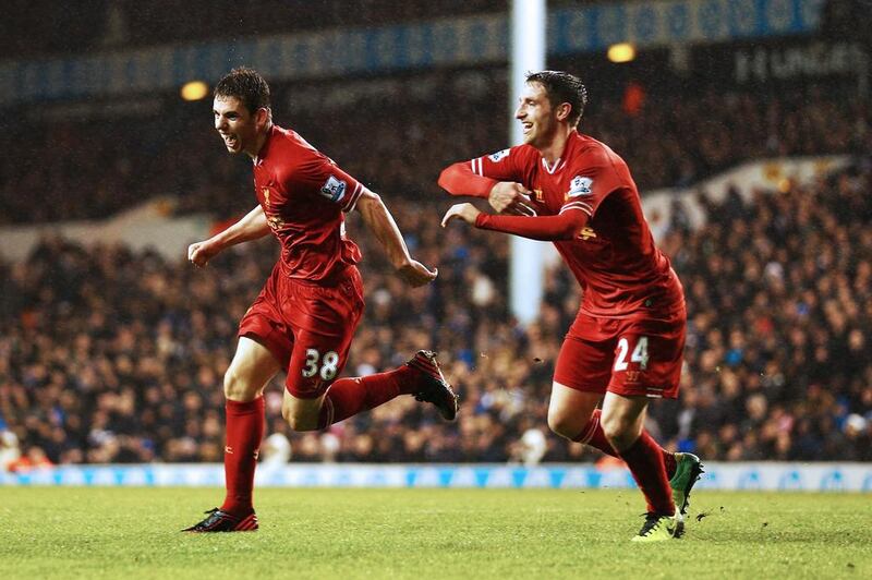 Jon Flanagan, left, is giving Liverpool fans plenty of reasons to get on their feet and cheer. Paul Gilham / Getty Images