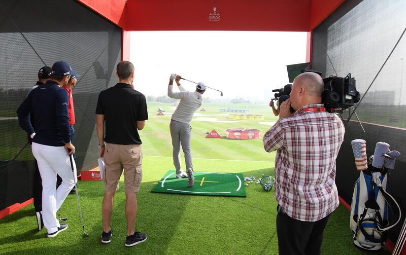 Dustin Johnson takes part in Top Golf Crush ahead of the Abu Dhabi HSBC Championship. Ross Kinnaird / Getty Images