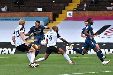 LONDON, ENGLAND - SEPTEMBER 12: Pierre-Emerick Aubameyang of Arsenal scores his team's third goal during the Premier League match between Fulham and Arsenal at Craven Cottage on September 12, 2020 in London, England. (Photo by Ben Stansall - Pool/Getty Images)