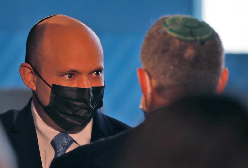 Naftali Bennett in discussion at the conference. AFP