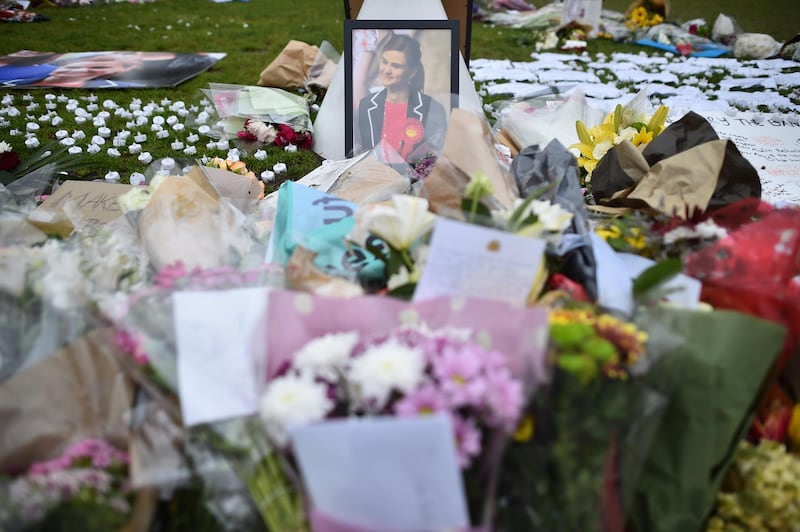Flowers and messages left in remembrance of slain Labour MP Jo Cox (photo) are pictured in Parliament Square in central London on June 19, 2016. - British MP Jo Cox was on Sunday remembered as a "21st century Good Samaritan" at a service of thanksgiving in the village where she was murdered. Three days after the 41-year-old MP died in a shooting and stabbing attack in the northern English town of Birstall, parishioners at St Peter's Church prayed for her widower Brendan and two young children, Lejla and Cuillin (Photo by BEN STANSALL / AFP)