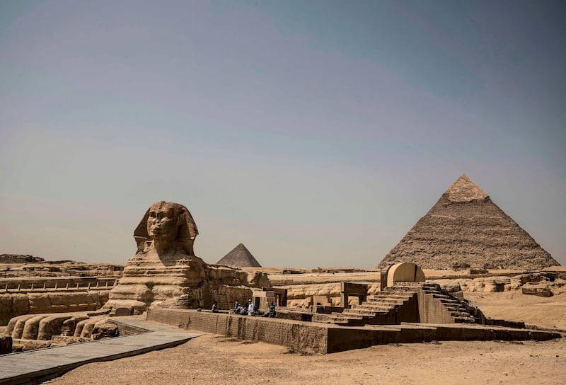 The Giza pyramids necropolis on the southwestern outskirts of the Egyptian capital Cairo is pictured empty after the site closed to the general public.   AFP