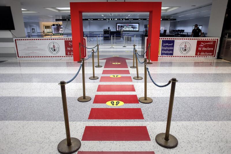 Social distancing markers line the floors to the passport control area in the departures hall at Rafik Hariri International Airport in Beirut. Bloomberg