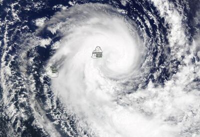 Nasa's Terra satellite provided a visible image of Tropical Storm Calvinia covering the island of Mauritius in the Southern Indian Ocean on Monday, December 30. Courtesy Nasa Worldview