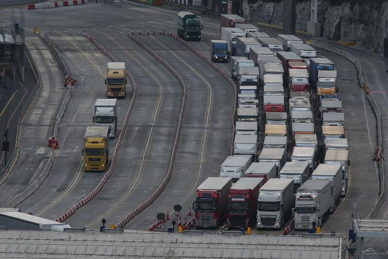 (FILES) In this file photo taken on March 19, 2018 Lorries queue at the entrance of the port of Dover on the south coast of England on March 19, 2018. Contemplating the chaos that Brexit could cause at the UK-France border, worried truck driver Peluso Donati told AFP: "There are days when it's a mess, but with this, it'll be even worse." He has to go through six tests in the hour before boarding the Eurotunnel undersea rail shuttle, including having the truck thoroughly checked over with sniffer dogs, and clearing French and British customs. More controls in the event of a no-deal Brexit could double these transit times, he said and as British Prime Minister Theresa May tries to convince MPs to accept her draft deal with the EU, which both Europhiles and Eurosceptics have vowed to torpedo, the threat of a sudden exit from the European Union without a negotiated agreement looms large. / AFP / Daniel LEAL-OLIVAS
