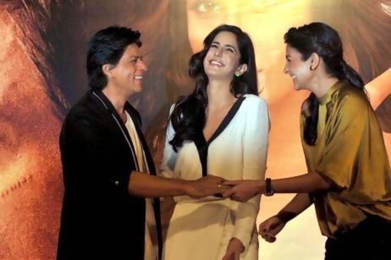 Shah Rukh Khan, left, with actresses Anushka Sharma, right, and Katrina Kaif. AFP