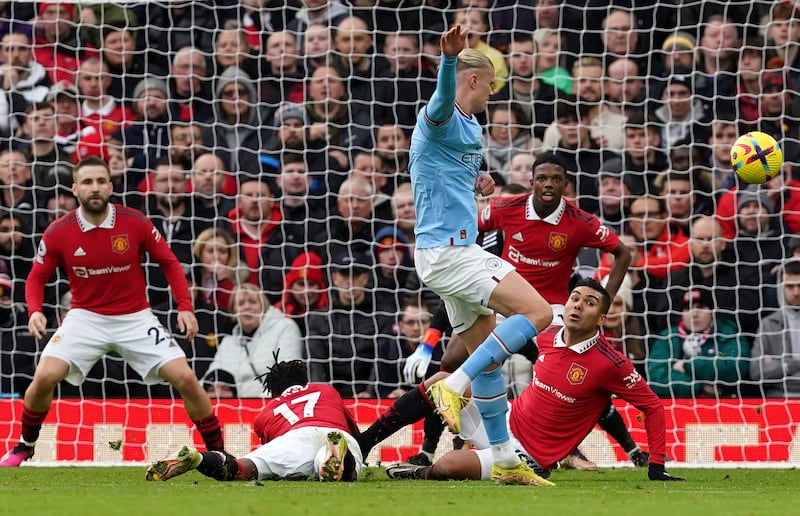 City's Erling Haaland see's his shot blocked by Fred and Casemiro. PA