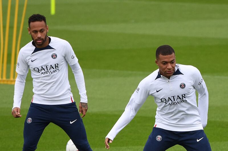 Kylian Mbappe and Neymar take part in PSG's training session at the Camp des Loges training ground. AFP