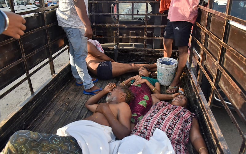 People affected by a chemical gas leak are carried in a lorry for medical treatment in Visakhapatnam, India. AP Photo