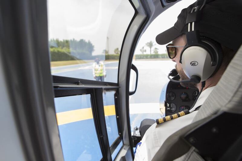 The helicopter was the French-made EC 130 B4, which was off the ground in seconds and soon heading out over the Gulf. Antonie Robertson / The National