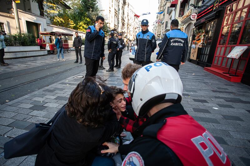 A boy is cared for after the explosion. Getty