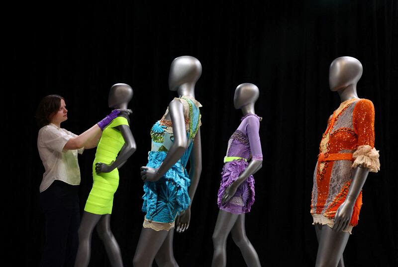 Dresses by Christopher Kane on display at the exhibition. Reuters