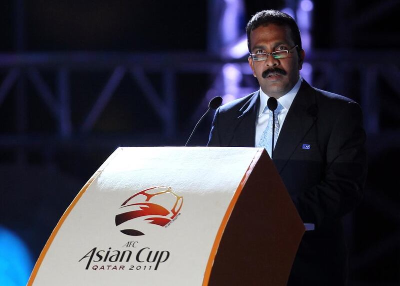 Asian Football Confederation secretary general Alex Soosay, shown here addressing the public during the AFC Asian Cup Qatar in 2011, stepped down Wednesday amid claims of a cover-up. AFP PHOTO/KARIM JAAFAR