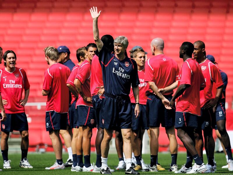LONDON - JULY 20:  Manager Arsene Wenger waves to the crowd during an Arsenal Training and Emirates Stadium Open Day at the Emirates Stadium on July 20, 2006, in London, England.  (Photo by Paul Gilham/Getty Images)