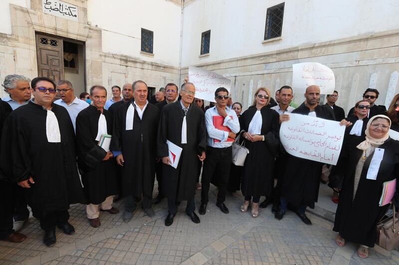 Tunisian lawyers protest against the assault of a lawyer Nesrine Karnah inside a police station office, outside a court in Tunis, Tunisia.  EPA