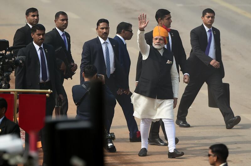 Prime Minister Narendra Modi waves to spectators after the end of Republic Day parade in New Delhi. Money Sharma / AFP