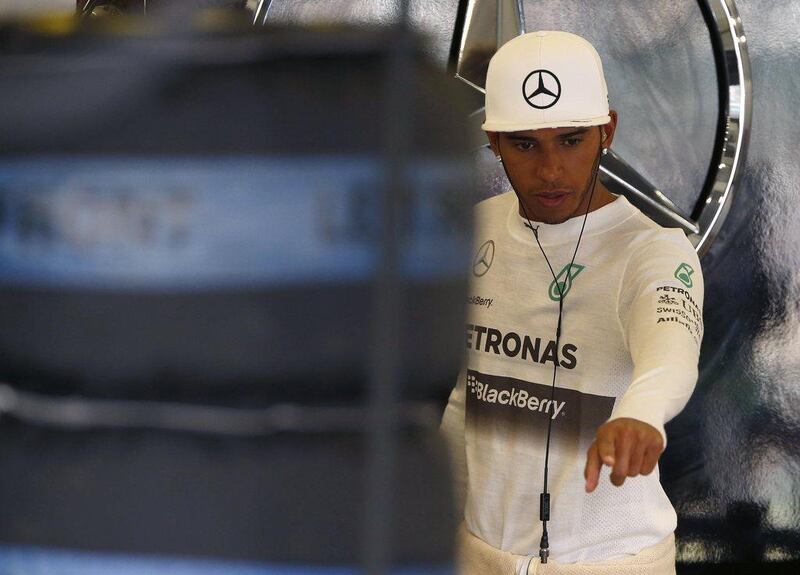 Lewis Hamilton gestures in his team garage on Friday during the practice sessions for the British Grand Prix. Phil Noble / Reuters / July 4, 2014