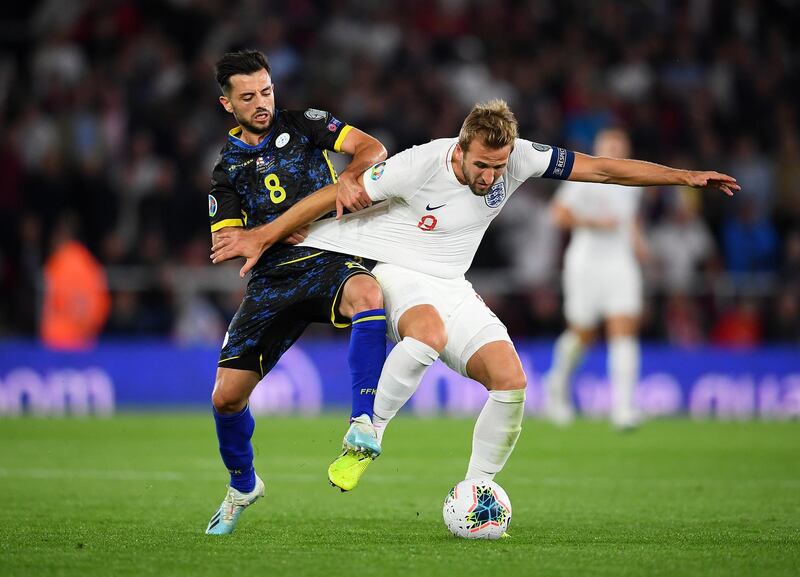 SOUTHAMPTON, ENGLAND - SEPTEMBER 10:  Harry Kane of England is tackled by Besar Halimi of Kosovo during the UEFA Euro 2020 qualifier match between England and Kosovo at St. Mary's Stadium on September 10, 2019 in Southampton, England. (Photo by Clive Mason/Getty Images)