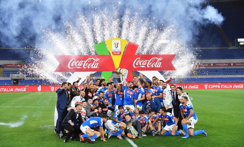 Napoli celebrate with the trophy. EPA