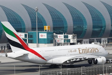An Emirates Airbus A380 at Dubai International Airport. The carrier nearly quadrupled its half year profits. EPA