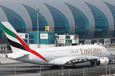 An Emirates Airbus A380 at Dubai International Airport. The carrier nearly quadrupled its half year profits. EPA