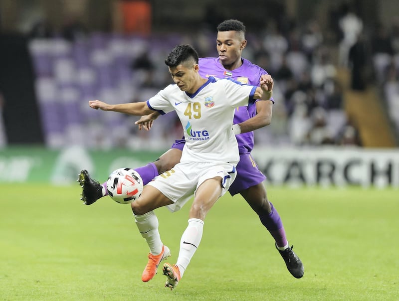 Al Ain, United Arab Emirates - Reporter: John McAuley: Saeed Juma of Al Ain battles with Farrukh Ikramov of Bunyodkor. Al Ain take on Bunyodkor in the play-off to game qualify for the 2020 Asian Champions League. Tuesday, January 28th, 2020. Hazza bin Zayed Stadium, Al Ain. Chris Whiteoak / The National