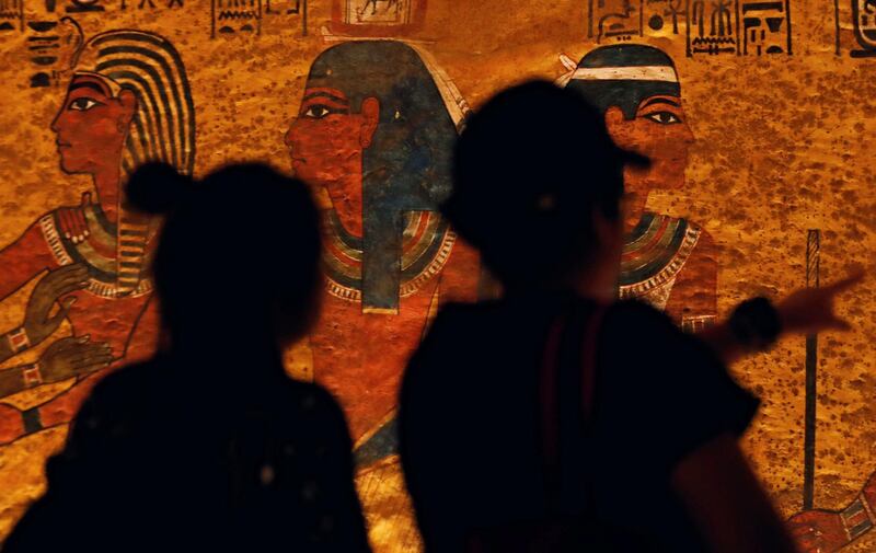 Visitors look at ancient Egyptian drawings on the newly renovated wall of boy pharaoh King Tutankhamun's tomb in Valley of the Kings in Luxor, Egypt January 31, 2019. REUTERS/Mohamed Abd El Ghany