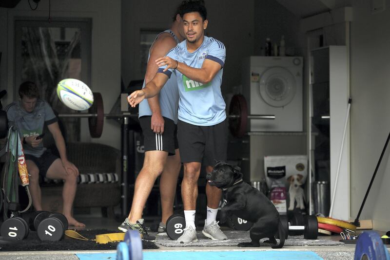 AUCKLAND, NEW ZEALAND - MARCH 27: Flatmates Stephen Perofeta, Finlay Christie and Tom Robinson of the Blues rugby team pictured during a weights session in their garage on March 27, 2020 in Auckland, New Zealand. The 2020 Super Rugby season was suspended on 14 March 2020 due to the ongoing COVID-19 pandemic and travel restrictions put in place which banned international travel. New Zealand is now in lockdown, with citizens required to remain at home as much as possible. All non-essential businesses are closed, including bars, restaurants, cinemas and playgrounds. Schools are closed and all indoor and outdoor events are banned. Essential services remain open, including supermarkets and pharmacies. New Zealand currently has 283 confirmed cases of COVID-19. (Photo by Phil Walter/Getty Images)
