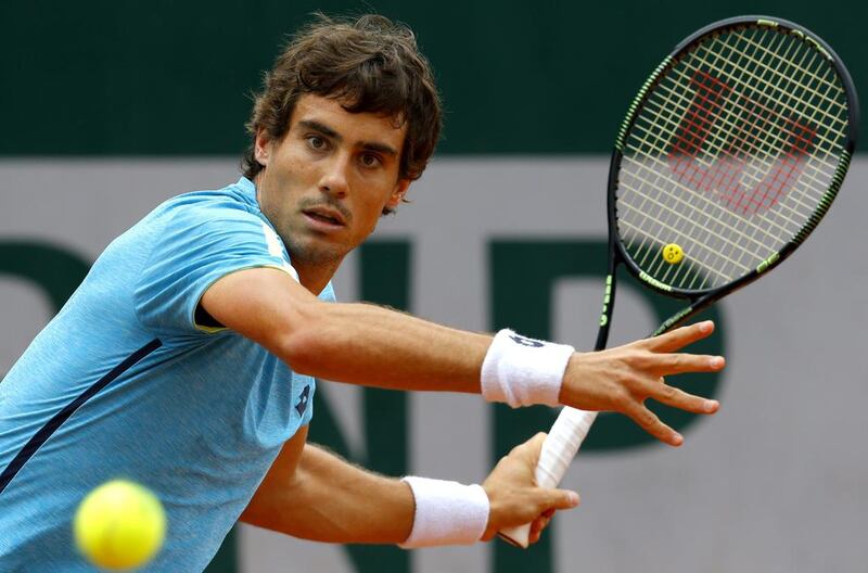 Guido Pella of Argentina in action against Diego Schwartzman of Argentina during their men’s single first round match at the French Open tennis tournament at Roland Garros in Paris, France, 23 May 2016.​ Robert Ghement / EPA