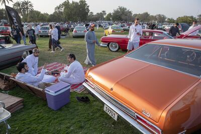 People gather over food and cars at The Grand Picnic by Flat 12 in Safa Park. Antonie Robertson / The National