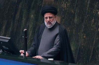 Iranian President Ebrahim Raisi addresses politicians at the parliament in Tehran on Wednesday. AP 
