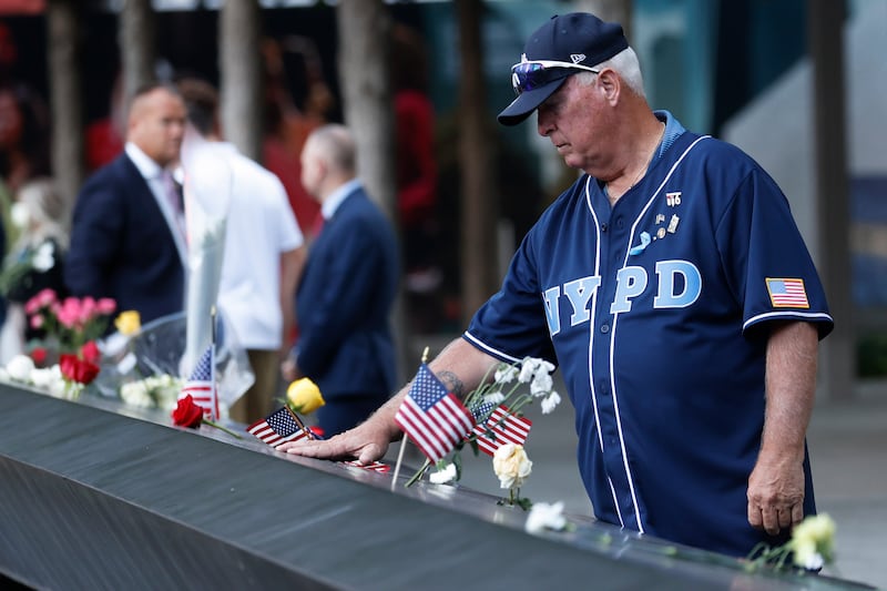 A man takes a moment to remember those who lost their lives in the attacks. EPA