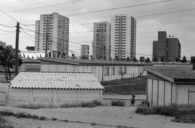 The housing estate, above in the background, where the Sedira family lived in the neglected Parisian suburb of Gennevilliers. Getty Images