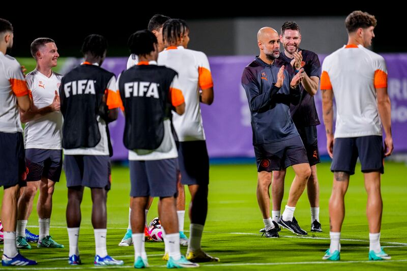 Manchester City manager Pep Guardiola applauds during training. AP 
