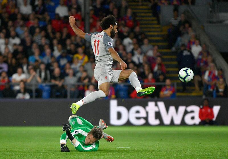 Mohamed Salah leaps over Crystal Palace goalkeeper Wayne Hennessey. EPA