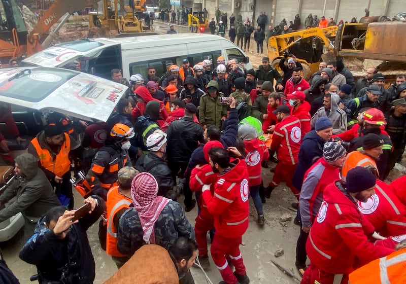 Rescuers work near the site of a collapsed building in Hama, Syria. Reuters