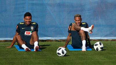 Casemiro, left, wants Brazil not to solely rely on Neymar for inspiration when Brazil take on Mexico in the second round on Monday. Hannah McKay / Reuters