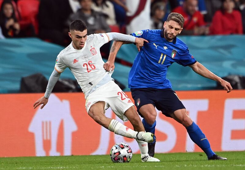 Spain's Pedri under pressure from Domenico Berardi in the Euro 2020 semi-final at Wembley Stadium in London. EPA