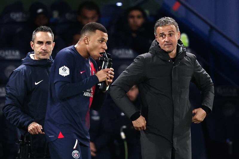 Paris Saint-Germain's head coach Luis Enrique, right, has guided his team to the top of Ligue 1 having turned down Napoli in the summer. AFP