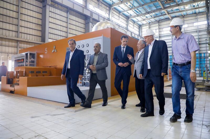 The president tours a thermal power station in the eastern countryside of Aleppo. AFP