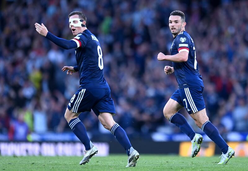 Scotland's Callum McGregor celebrates pulling a goal back to make it 2-1. PA