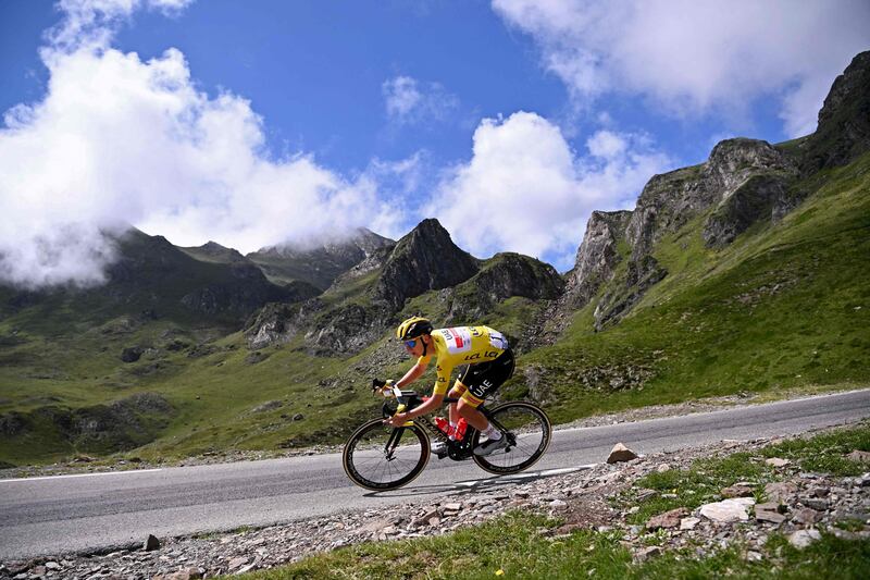Team UAE Emirates' Tadej Pogacar of Slovenia wearing the overall leader's yellow jersey descends the Tourmalet pass during the 18th stage on Thursday.
