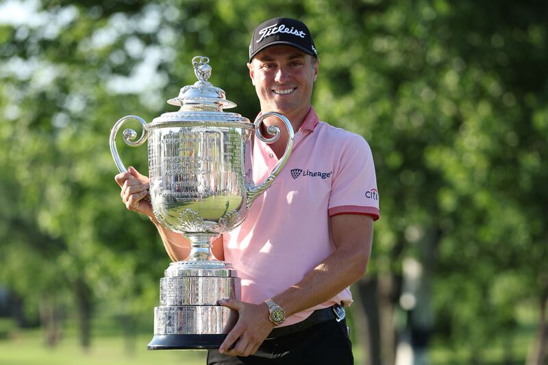 Justin Thomas celebrates with the Wanamaker Trophy after winning the 2022 USPGA Championship at Southern Hills Country Club. AFP