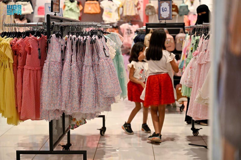 Families shop for clothing in the lead-up to Eid Al Fitr